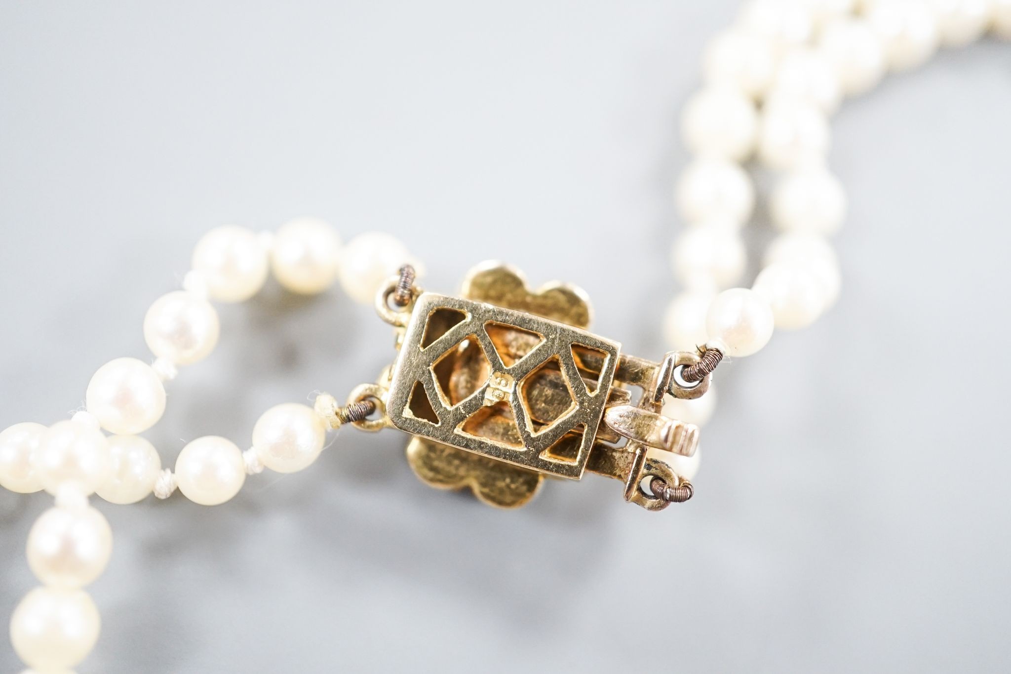 A double strand cultured pearl necklace, with 9ct and cultured pearl cluster clasp, 43cm.